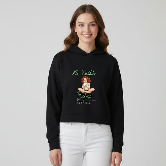 Model wearing women’s cropped hoodie with No Talkie Before Coffee printed design - Artisianaura